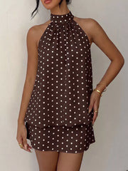 Chic polka dot halter mini dress in coffee brown with white dots, featuring a gathered neckline and sleeveless design.