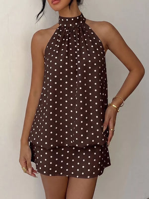 Chic polka dot halter mini dress in coffee brown with white dots, featuring a gathered neckline and sleeveless design.
