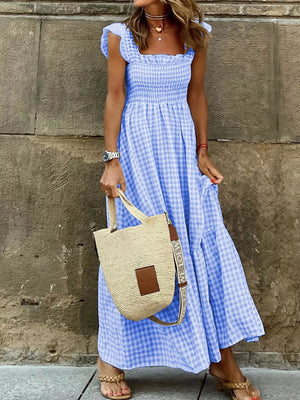 Gingham ruffled maxi dress in sky blue with smocked bodice and tiered skirt.