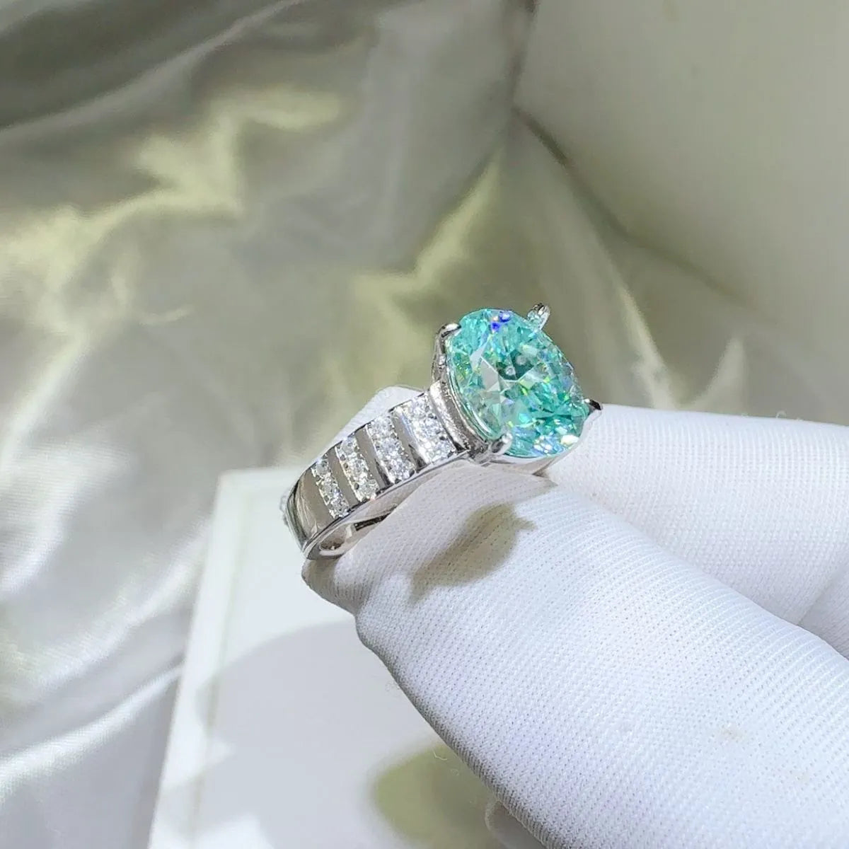 Aquamarine halo oval ring with diamond band detail