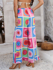 Geometric print wide-leg trousers in multicolor with sun motifs and drawstring waist.