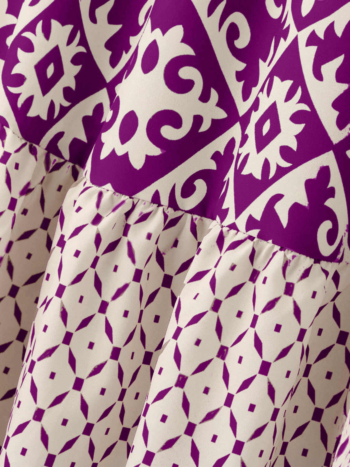 Tiered maxi skirt in purple and beige medallion print with ruffled tiers.
