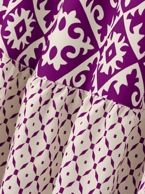 Tiered maxi skirt in purple and beige medallion print with ruffled tiers.