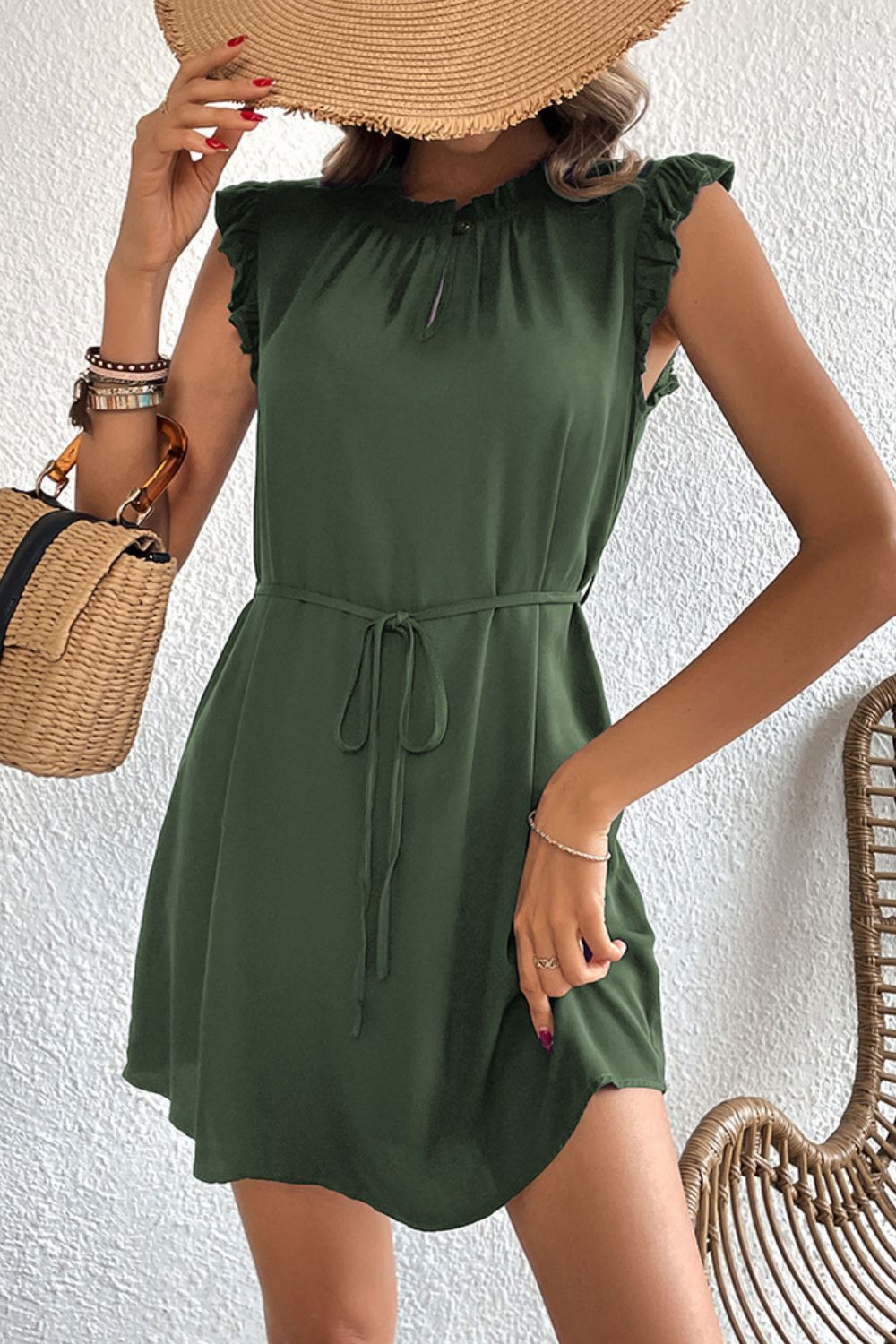 Army green mini dress with ruffled yoke, keyhole neckline, and tie waist.