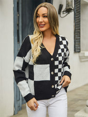 Checkerboard block knit cardigan with V-neck and button front in black and white.