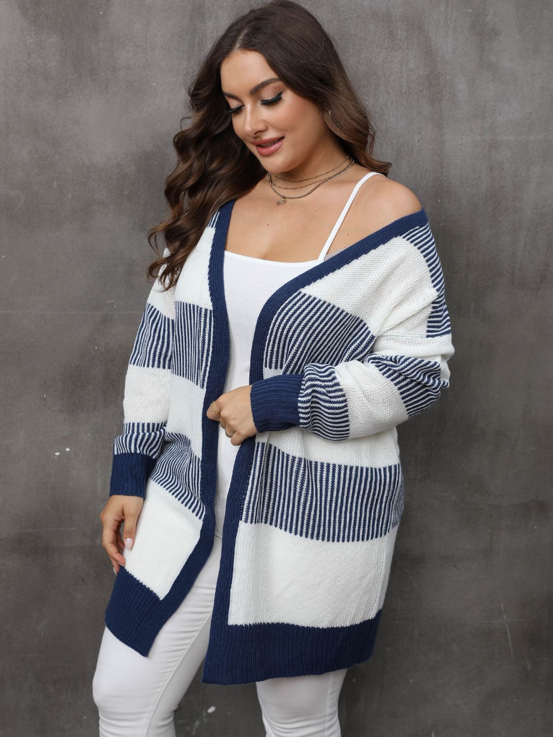 Striped open-front knit cardigan in dark navy and white, 100% acrylic, with a relaxed fit.