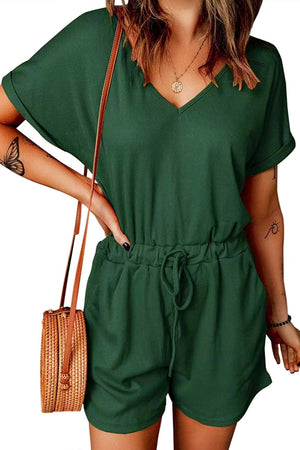 Dark green ribbed V-neck romper with adjustable drawstring waist and cuffed short sleeves.