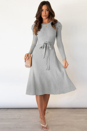 Light gray cable knit midi dress with long sleeves and self-tie belt