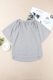 Gray relaxed V-neck blouse with cap sleeves and gathered neckline