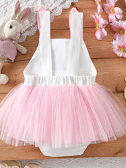 Baby white one-piece with pink tulle skirt and bunny ears on straps.