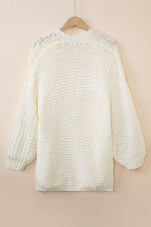 Cream textured knit cocoon cardigan with balloon sleeves and ribbed cuffs.