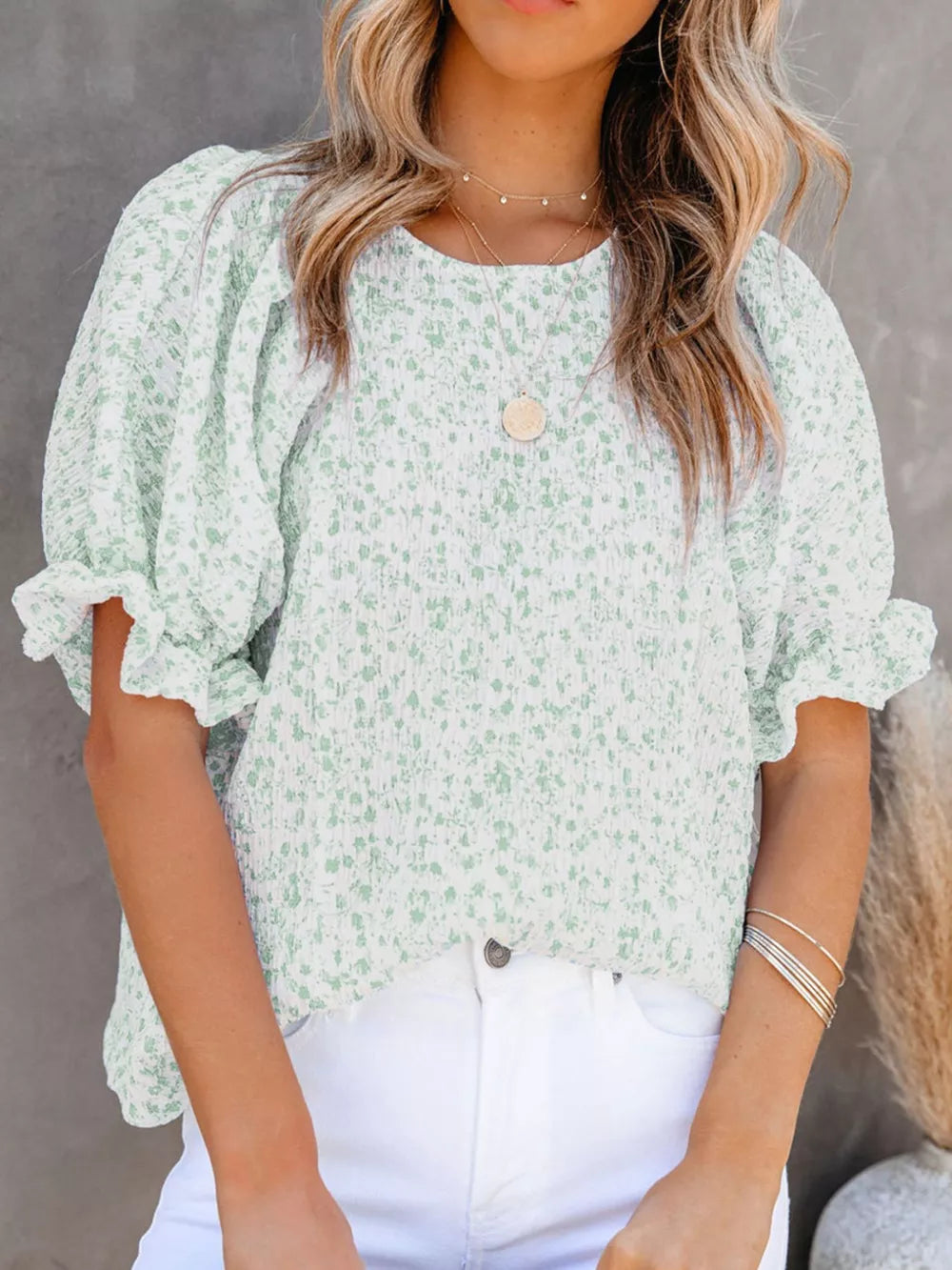 Green floral print maternity blouse with smocked bodice and ruffle sleeves