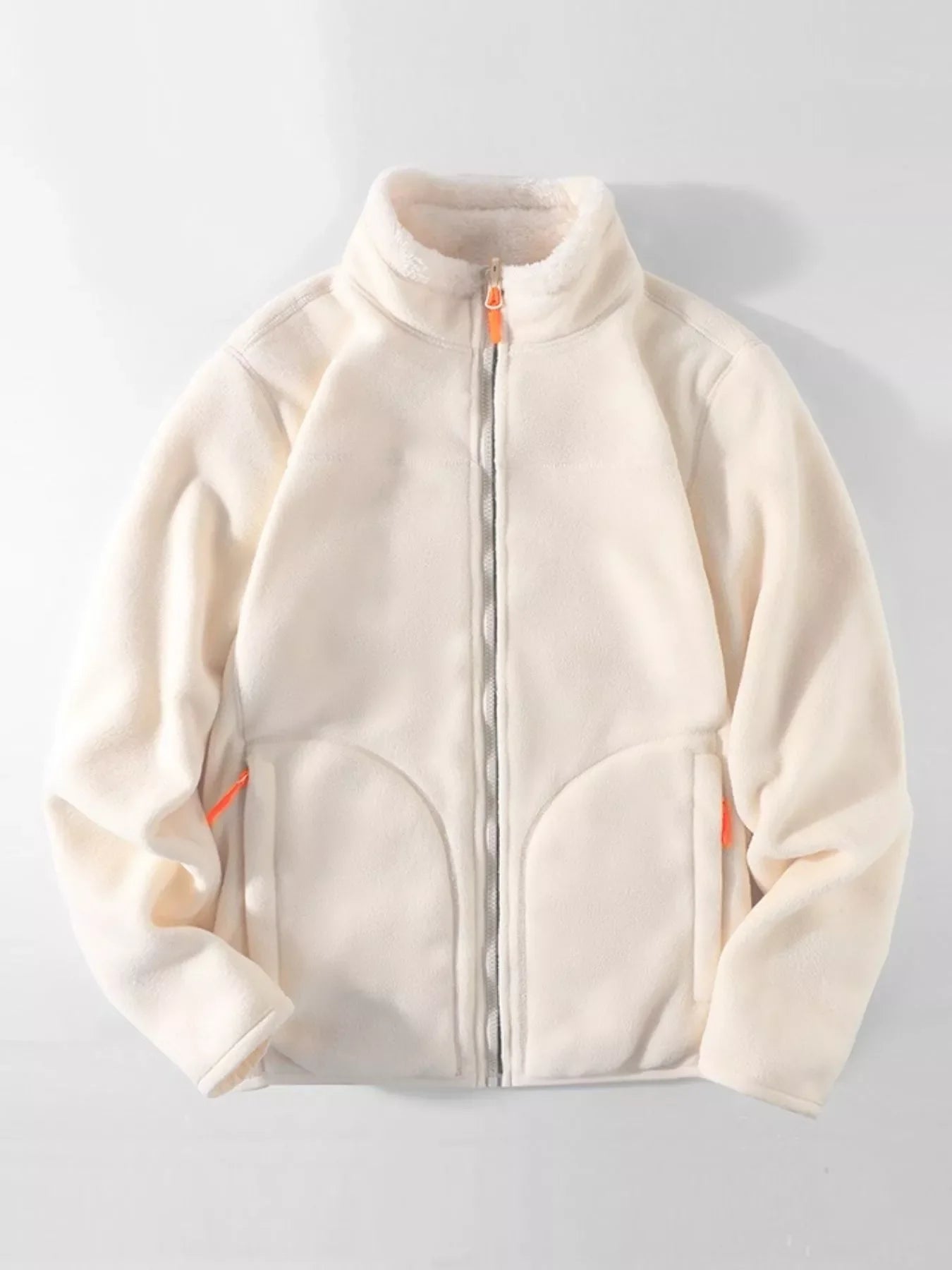 Fleece lined full zip sweatshirt in beige with orange zipper accents and sherpa collar.
