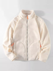 Fleece lined full zip sweatshirt in beige with orange zipper accents and sherpa collar.