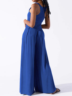 Royal blue square neck palazzo jumpsuit with wide legs and pleats.