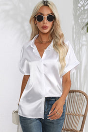 White satin cuffed sleeve button-down blouse with a relaxed fit.