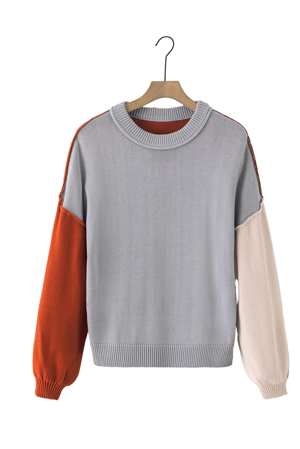 Sweater with colorblock sleeves in gray, orange, and tan acrylic, featuring balloon sleeves.