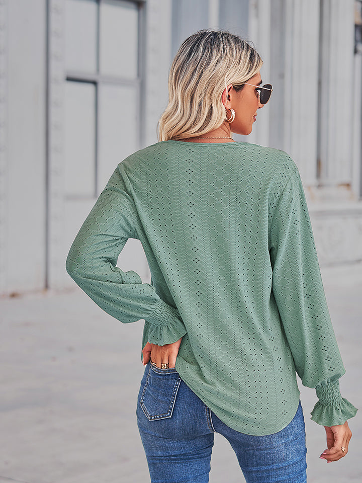 Gum Leaf eyelet blouse with lace trim cuffs and diamond pattern.