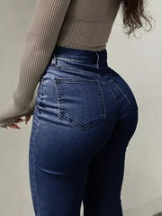 Dark blue denim maternity jeans with pockets and a sculpted flare leg.