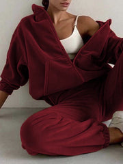 Burgundy fleece hoodie and jogger set with zip front and pockets.