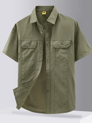Men's short sleeve button-down shirt in military green with two chest pockets.