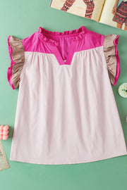 Blush pink and light blue colorblock blouse with ruffle yoke and flutter sleeves.