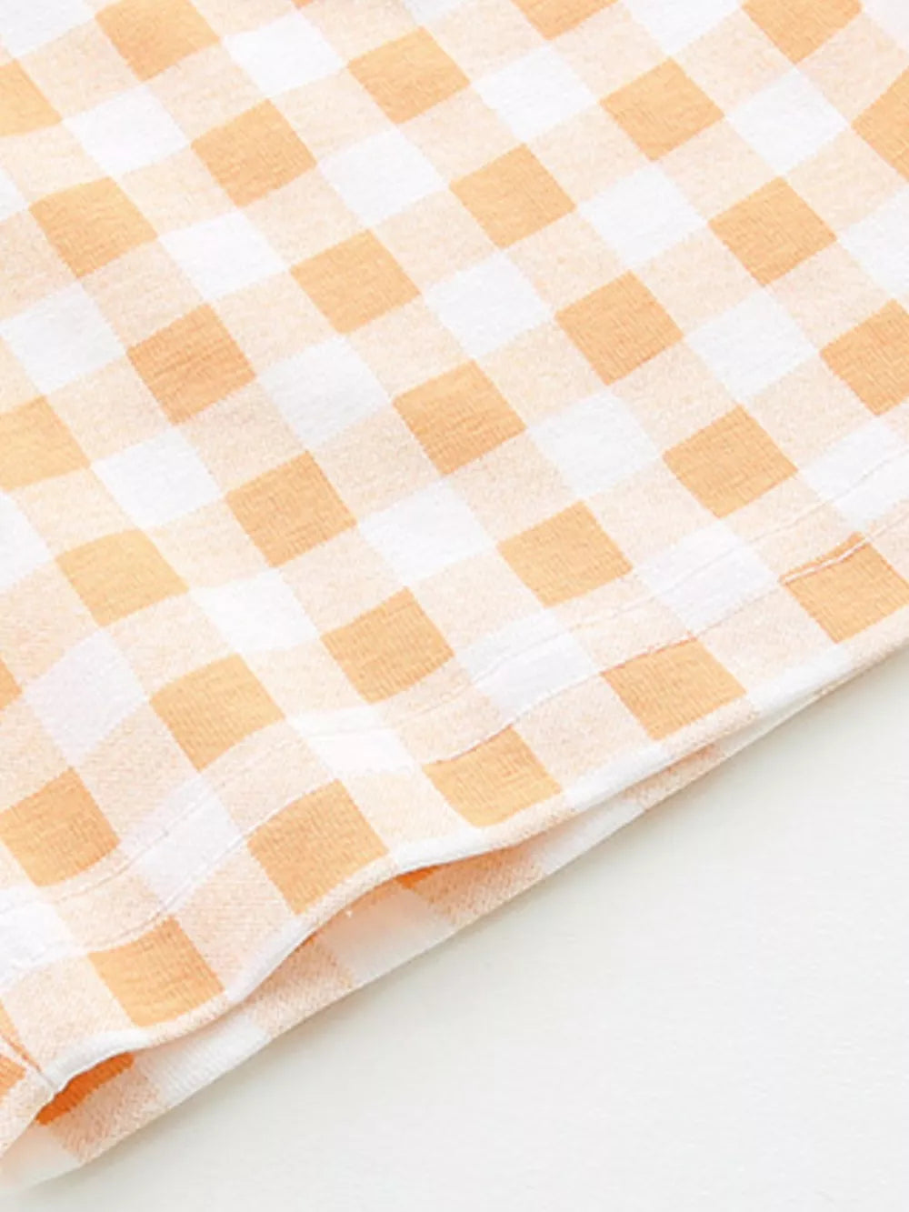 Toddler boys' cotton tee and shorts set in orange and white gingham pattern.