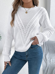 White chevron knit sweater with eyelet details and crew neck.