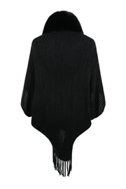 Black knit cape with faux fur collar and fringe hem