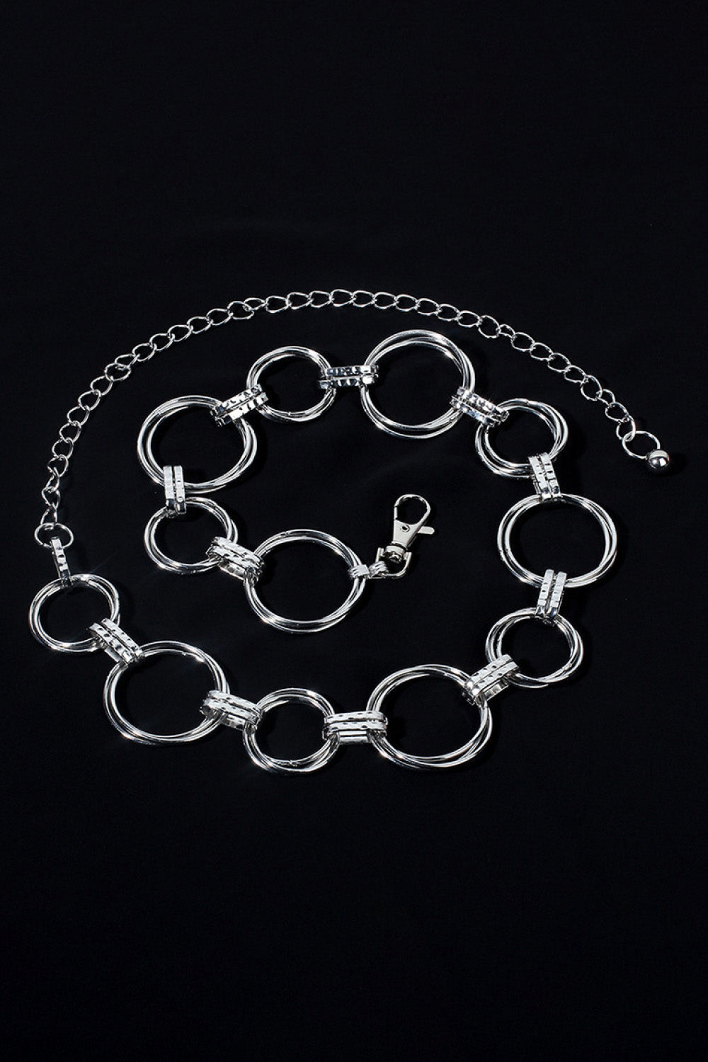 Silver alloy linked circle waist chain belt with lobster clasp and extender chain.