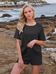 Black textured knit co-ord set with relaxed fit t-shirt and shorts.