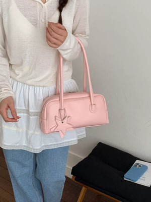 Pink shoulder bag with star charm and double handles