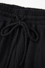 Black textured ribbed lounge set shorts with drawstring waist
