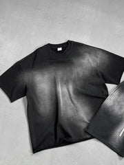 Black oversized t-shirt with faded wash and raw hem