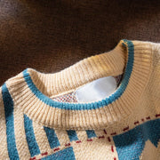 Men's apricot knit sweater with blue and red checkered heart pattern and crew neck.