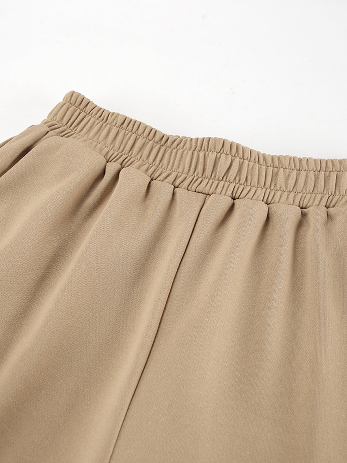 Camel quarter zip top and pants set with elastic waistband detail.