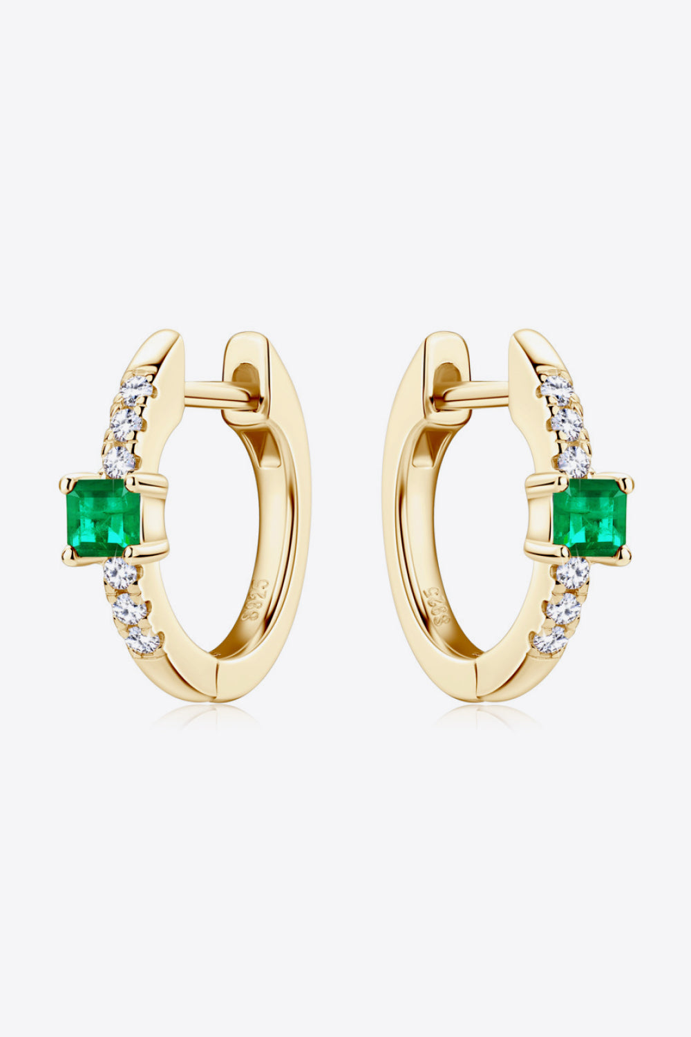 Gold huggie hoop earrings with emerald and pave diamond accents