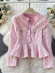 Blush pink lace peplum top with bow neck and jeweled buttons