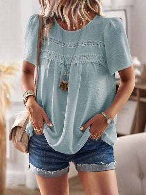 Light blue textured puff sleeve yoke blouse with lace trim and boho details.