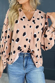 Blouson sleeve spot print silk blouse in dust storm with a v-neck.