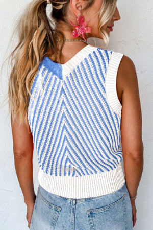 Chevron knit vest with blue and white stripes and a V-neck.