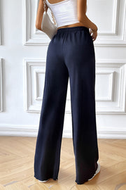 Dark blue textured rib wide-leg drawstring trousers with a comfortable fit.