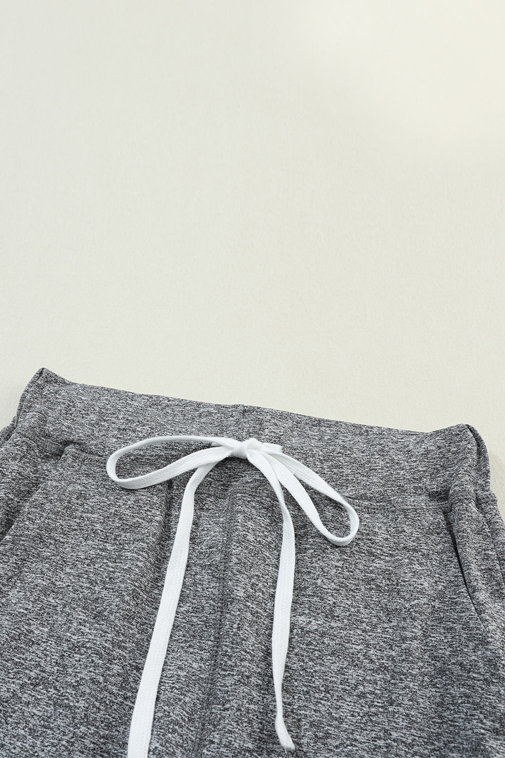 Slim-fit joggers in dark gray heather with white drawstring detail
