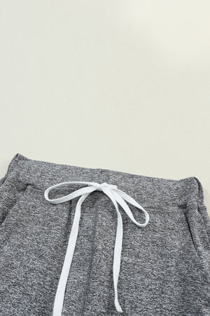 Slim-fit joggers in dark gray heather with white drawstring detail