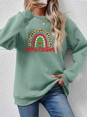 Sage green sweatshirt with rainbow Christmas graphic and leopard print detail.