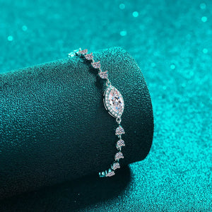 Silver adjustable bracelet with a central marquise-cut crystal and smaller cluster charms.