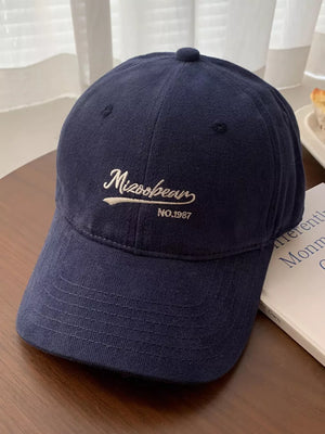 Navy blue cotton baseball cap with embroidered white text detail