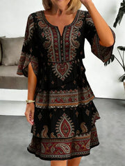 Black paisley print tiered mini dress with split sleeves and v-neck