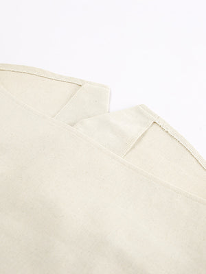 Buttoned vest and shorts set in natural cotton fabric with visible stitching details.