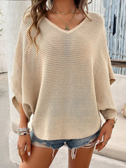 Tan open-knit dolman sleeve v-neck sweater with a relaxed fit.